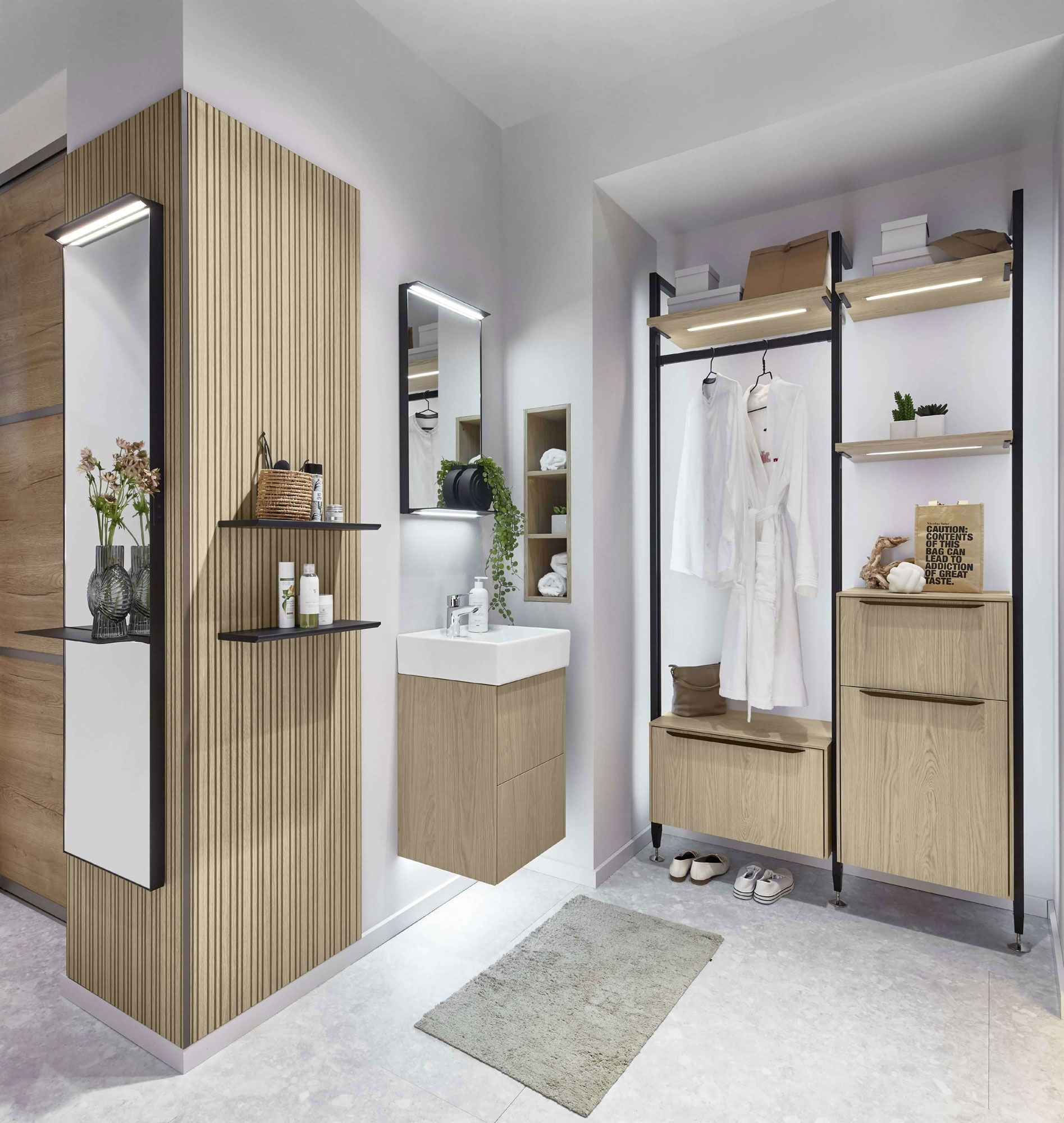 Offen gestalteter Wasch- und Garderobenbereich mit vertikaler Holzstruktur, integriertem Waschtisch und funktionalen Stauraummöbeln. Die klare Raumplanung verbindet Bad- und Flurbereich zu einer modernen, harmonischen Einheit mit hochwertigen Materialien.