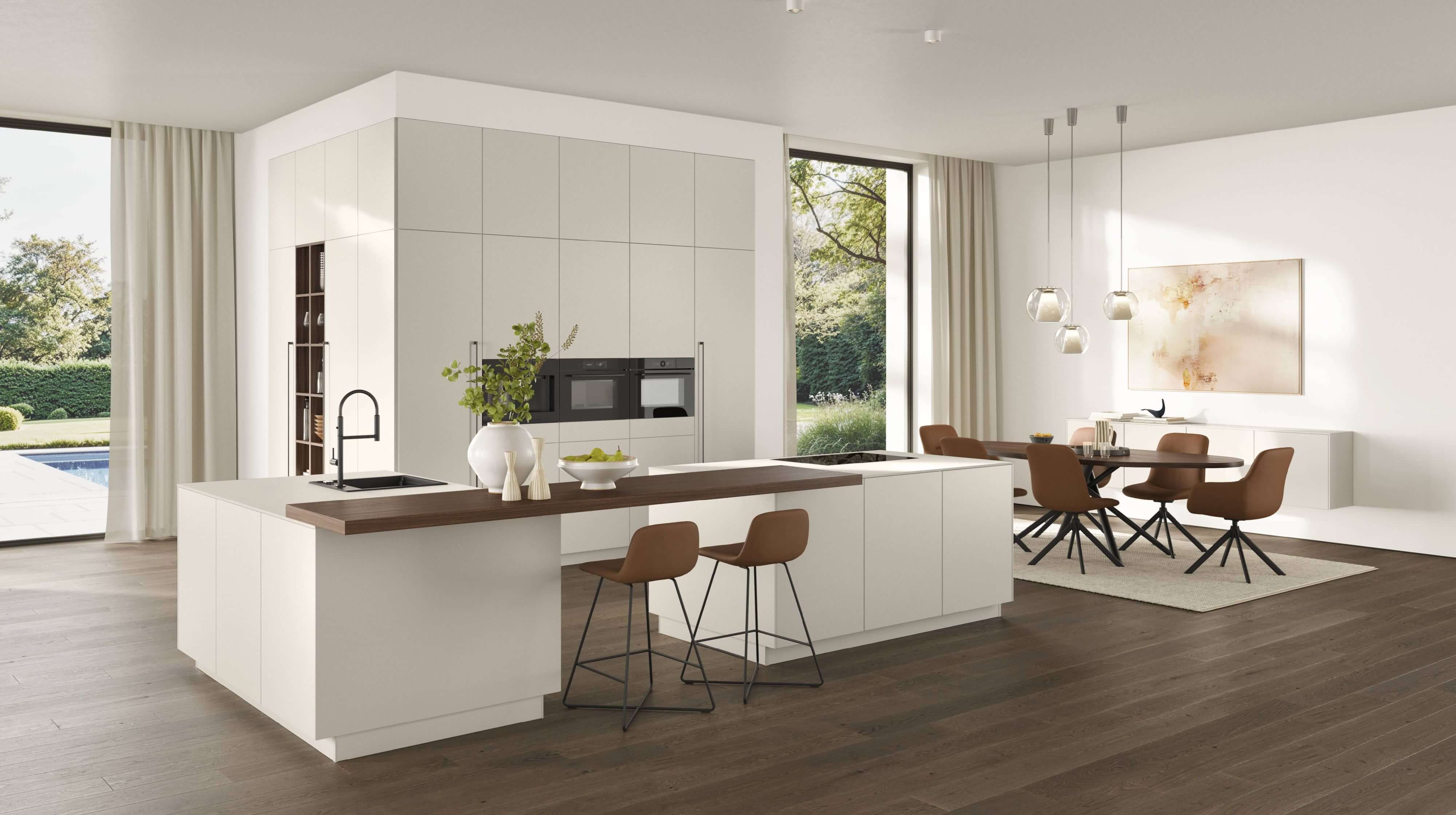 Elegante moderne Küche mit großzügiger Kochinsel und einer Bar. Helle Farbenfinden sich im offenen Essbereich mit der Küche wieder.